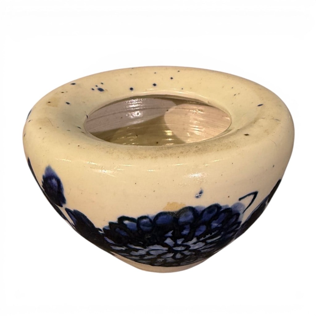 Chinese Blue and White Porcelain Bowl: Chinese blue and white porcelain bowl of rounded form with thick rolled rim and small raised foot, decorated to the exterior with bold underglaze cobalt blue floral and foliate decoration. The
