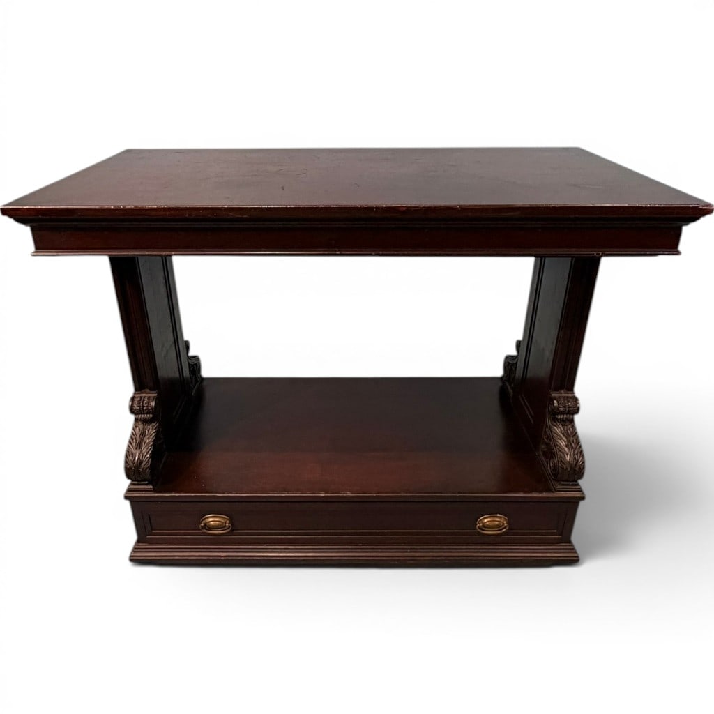 Mahogany Three-Tier Metamorphic Library Table: Mahogany three-tier metamorphic library table, late 19th to early 20th century, having a rectangular top above two lower graduated shelves, the whole raised on paneled end supports with carved