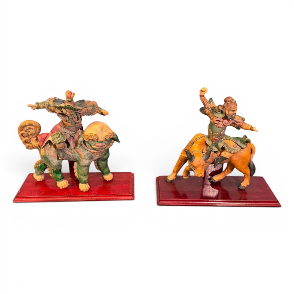 Pair of Chinese Polychrome Glazed Earthenware Guardian Figures, Qing Dynasty, 19th C.: Pair of Chinese polychrome glazed earthenware guardian figures, Qing Dynasty, 19th century, each modeled as a mounted warrior figure, one riding a Buddhist lion and the other riding an ox or buffalo, 