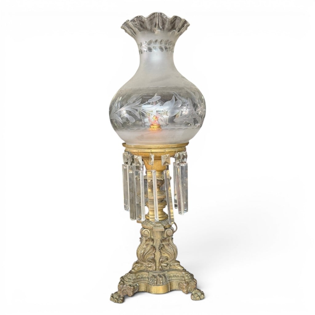 Gilt Brass Astral Lamp: Fine 19th century gilt brass astral lamp, having ornate cast base with paw feet, turned standard, circular font, hanging cut glass prisms, and frosted and etched glass shade with ruffled rim. Retains 