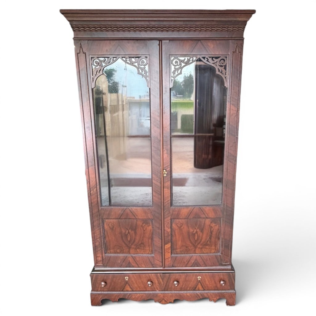 Victorian Rosewood Bookcase / Display Cabinet: Victorian rosewood two-door bookcase/display cabinet, mid-19th century, the projecting molded cornice above a case with paired glazed doors, pierced Gothic arch tracery, rope twist and bead moldings,