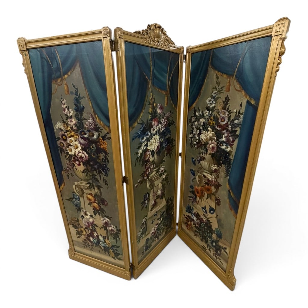 Three Panel Painted Canvas Screen, Floral Still Life Decoration: Three panel painted canvas screen, each panel decorated with a floral still life before painted blue drapery, set within a giltwood frame with classical style crest, molded borders, corner blocks,