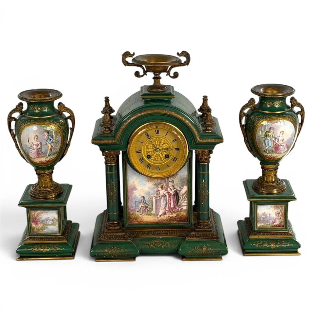 French Green Sevres-Style Clock Garniture: Origin: FranceDate: Late 19th early 20th centuryPeriod/Style: Louis XVI Revival in the Sevres tasteMaterials: Green-ground porcelain, polychrome and gilt decoration, gilt metal, brass, glass, and stee