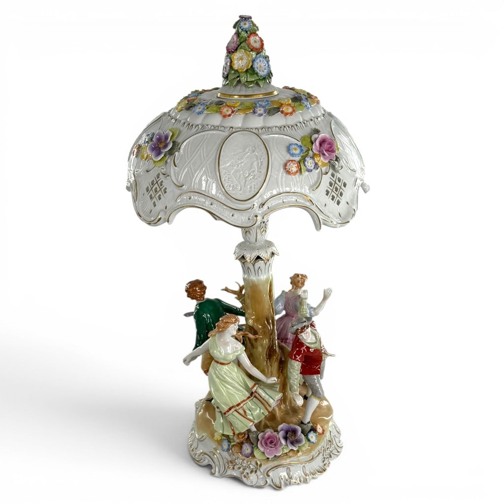 Von Schierholz Figural Porcelain Lamp: Maker: Von Schierholz Porcelain ManufactoryOrigin: Plaue, Thuringia, GermanyDate: First half 20th centuryPeriod/Style: Rococo Revival in the Dresden tasteMaterials: Hand-painted and gilt porcelain, li