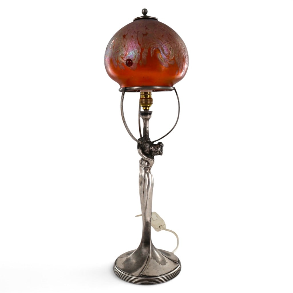 Argentor Jugendstil Figural Table Lamp with Loetz-Attributed Iridescent Glass Shade: Maker: Argentor-Werke Rust & Hetzel, Vienna; glass shade attributed to Joh. Loetz Witwe, Klosterm?hle, BohemiaDate: Early 20th century, circa 1902?1910Period/Style: Austrian Jugendstil / Vienna Secess