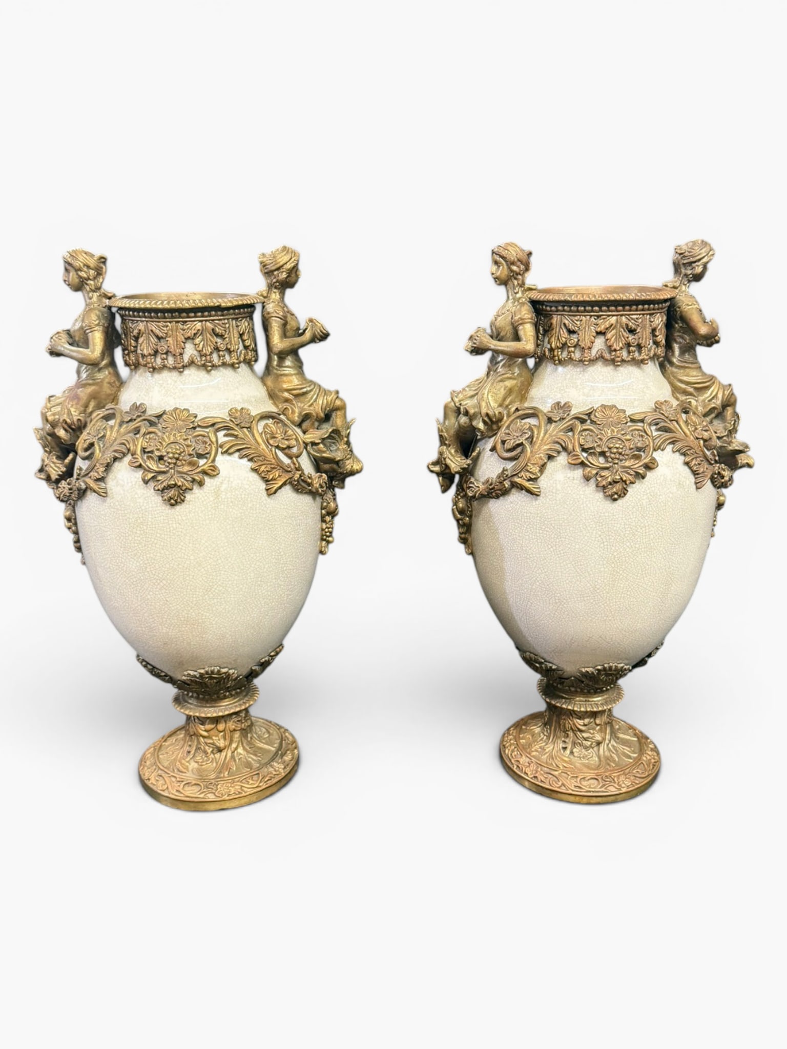 Pair French Gilt-Brass Mounted Porcelain Figural Urns: Date: Late 19th to early 20th century, circa 1890?1910Period/Style: French Belle ?poque, Louis XVI RevivalMaterials: Crackle-glazed porcelain and gilt brassForm: Pair of decorative urnsDescription: A