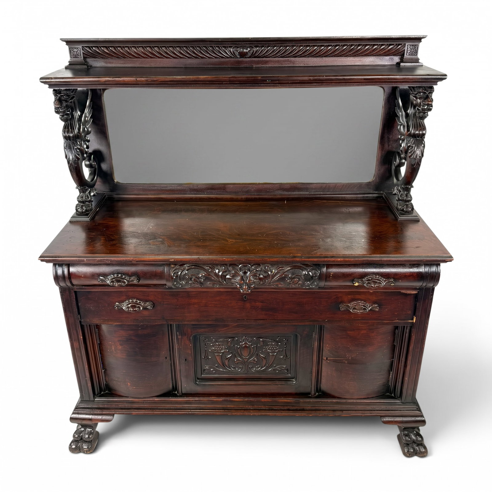 R.J. Horner Oak Griffin Sideboard: Maker: R.J. Horner and CompanyOrigin: New York CityDate: Circa 1890-1900Period/Style: American Renaissance RevivalMaterials: Carved quarter-sawn oak, mirror glass, secondary woods, and metal hardwareF