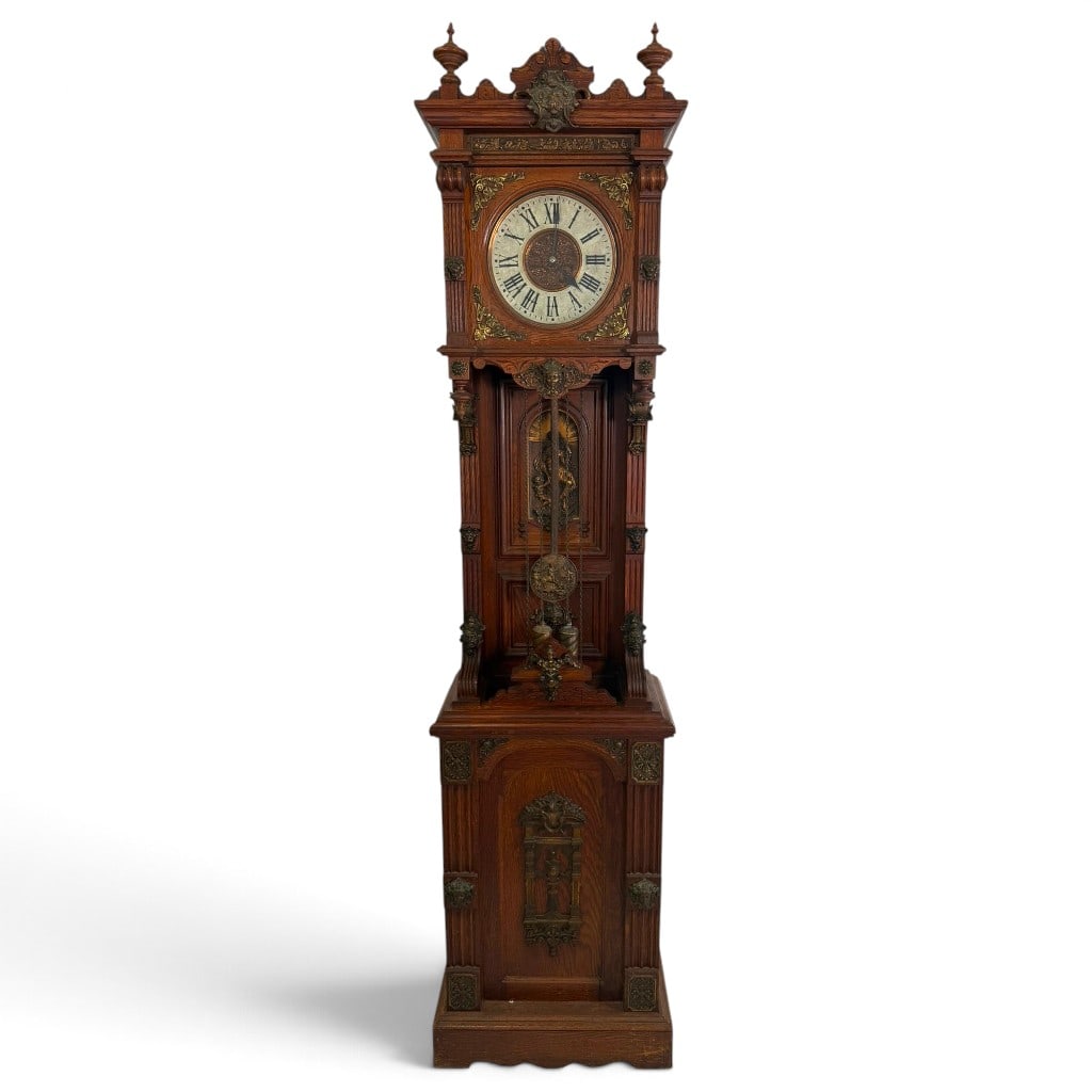 Ansonia Antique Standing Tall Case Clock: Maker: Ansonia Clock CompanyModel: Antique StandingOrigin: New York, New YorkDate: Circa 1901Period/Style: American Renaissance Revival, Historicist tasteMaterials: Oak, mixed secondary woods, brass m
