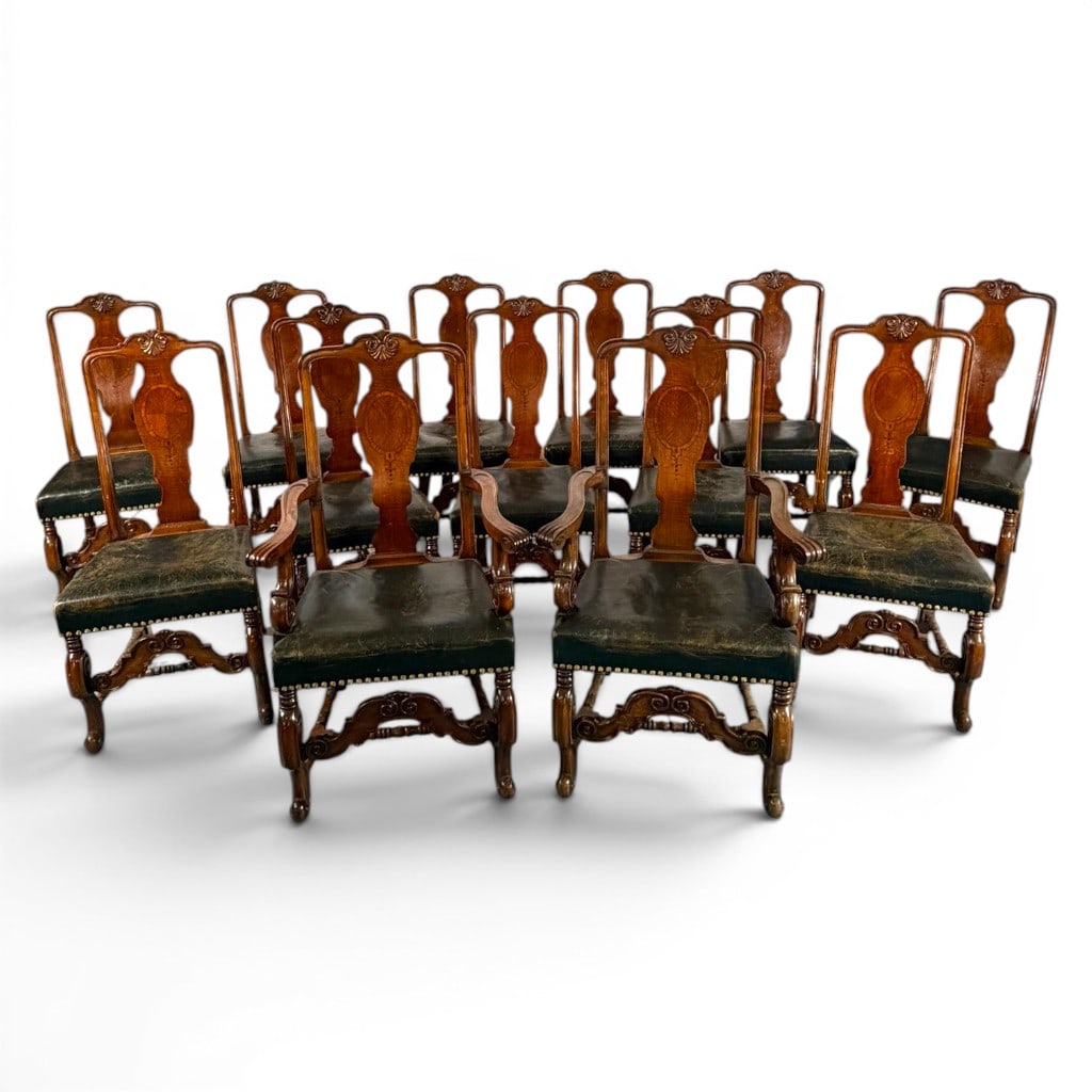 Set 13 Dutch Baroque Revival Chairs: Origin: Continental European, probably NetherlandsDate: Circa 1890-1910Period/Style: Dutch Baroque RevivalMaterials: Walnut, contrasting line inlay, leather, and brass nailheadsForm: Dining chair