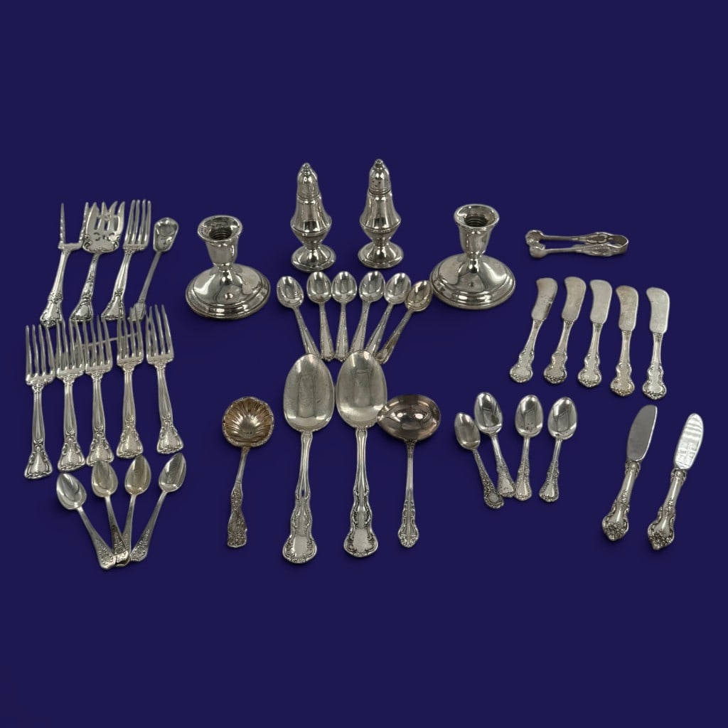 39-Pc. Sterling Silver Table Group: Date: Primarily 20th centuryMaterials: Sterling silver with weighted and steel componentsDescription: Assembled group of thirty-nine sterling silver table articles in assorted patterns and by various 