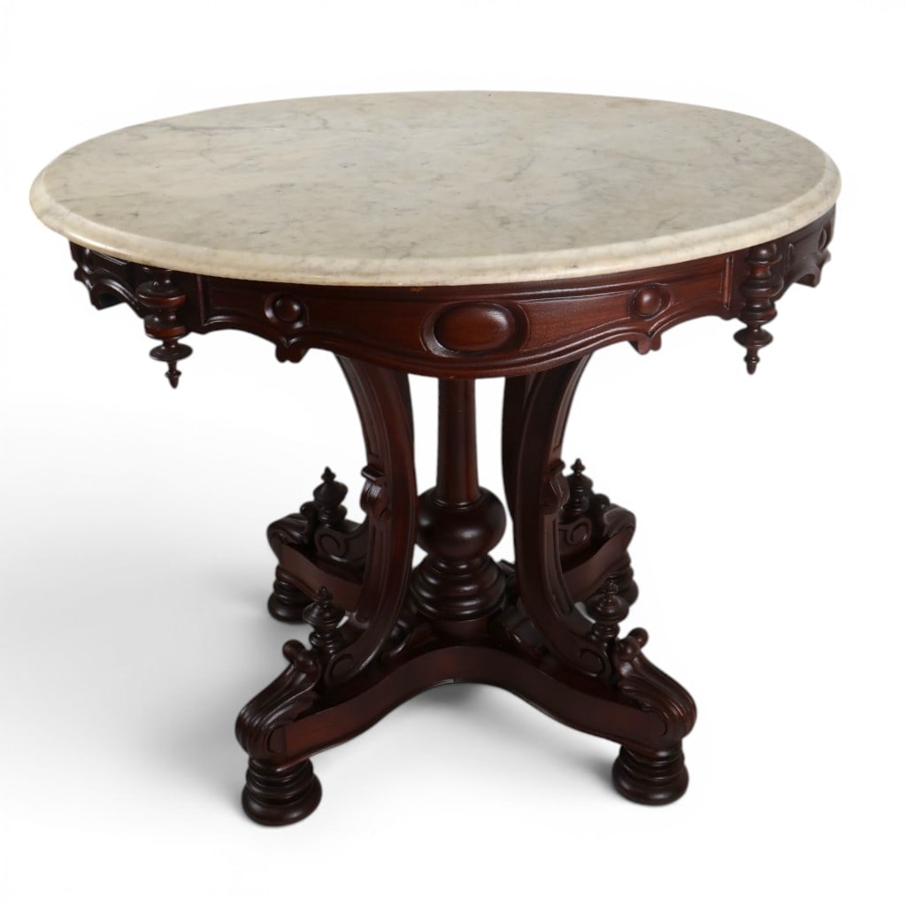 Attr. Thomas Brooks Marble-Top Table: Maker: Attributed to Thomas Brooks (1811-1887)Origin: Brooklyn, New YorkDate: Circa 1865-1870Period/Style: American Renaissance RevivalMaterials: Walnut, white marble, and metal castersDescription: At
