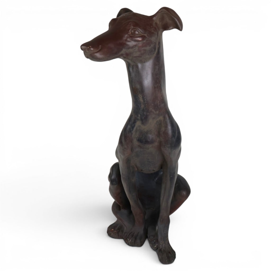 Painted Plaster Greyhound Figure: Date: Early to mid-20th century. Materials: Plaster of Paris and paint. Description: Large early to mid-20th-century plaster figure of a seated greyhound or whippet. The alert dog is modeled with an