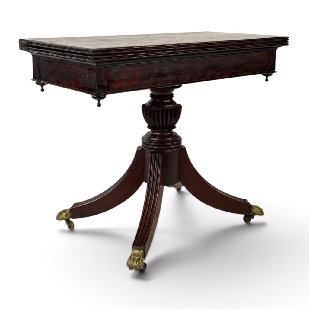 American Classical Mahogany Card Table, Baltimore, Maryland, Circa 1820: Origin: Baltimore, Maryland. Date: Circa 1820. Period/Style: American Classical. Materials: Mahogany, figured mahogany veneer, mixed secondary woods, and brass. Form: Swivel-top card or games table.