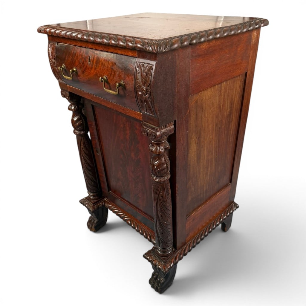 American Classical Mahogany Workstand: Origin: American Date: Circa 1830-1845 Period/Style: American Classical Materials: Mahogany, figured mahogany veneer, mixed secondary woods, and brass Form: Cabinet-form workstand or bedside stand