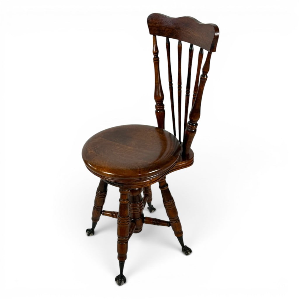 Victorian Oak Swivel Piano Chair: Origin: American Date: Circa 1890-1910 Period/Style: Late Victorian Materials: Oak, cast metal, and glass Form: Revolving piano or music chair Description: Late Victorian American oak revolving