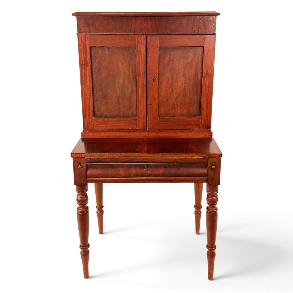 American Sheraton Figured Mahogany Plantation Desk: Origin: American Date: Circa 1825-1840 Period/Style: Late Federal or Sheraton Materials: Mahogany, figured mahogany veneer, mixed secondary woods, green baize, and brass Form: Plantation desk or desk