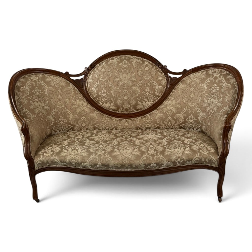 Victorian Walnut Triple-Back Sofa: Origin: American Date: Circa 1870-1890 Period/Style: Late Victorian, Rococo Revival Materials: Walnut and damask upholstery Form: Triple-medallion parlor sofa Description: American late-Victorian