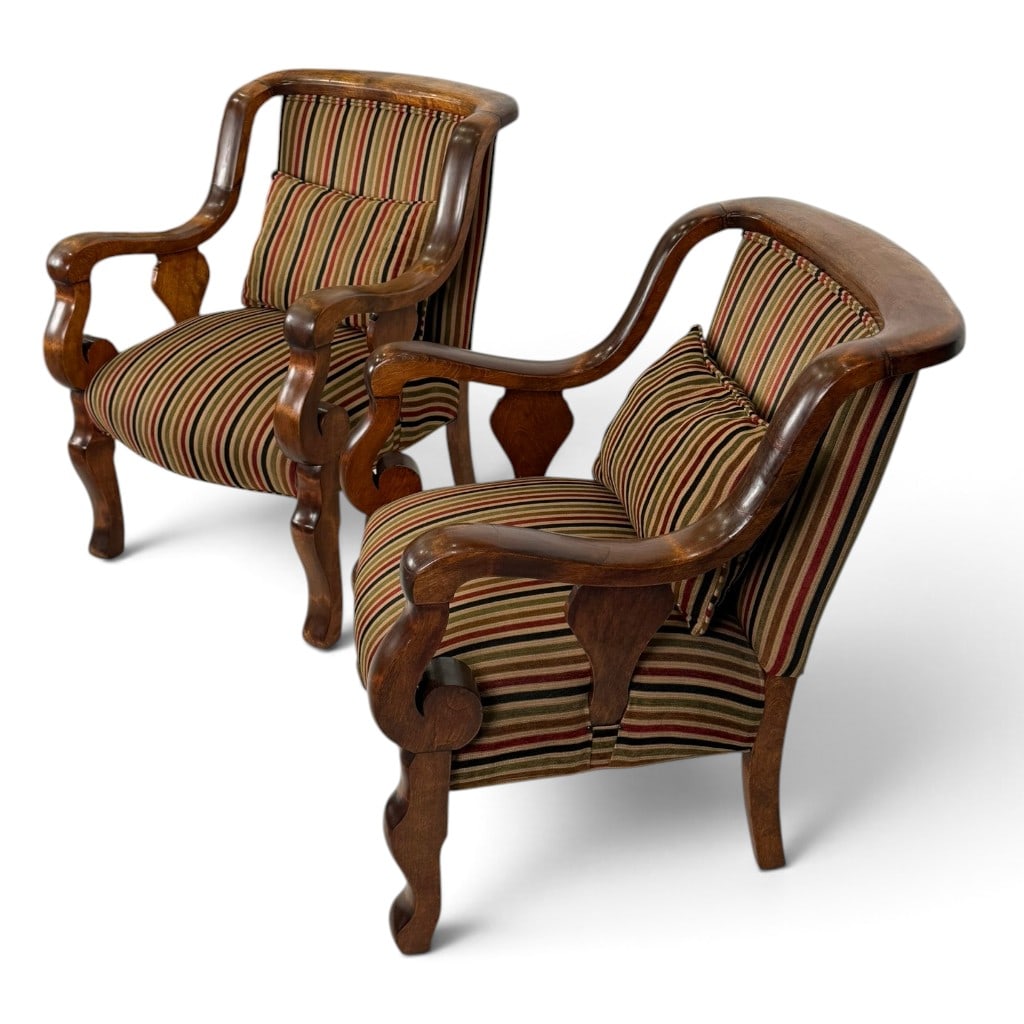 Pair of French Art Deco Walnut Armchairs: Origin: French Date: Circa 1925-1935 Period/Style: Art Deco Materials: Walnut and striped upholstery Description: Substantial and unusually sculptural pair of French Art Deco walnut armchairs. Each