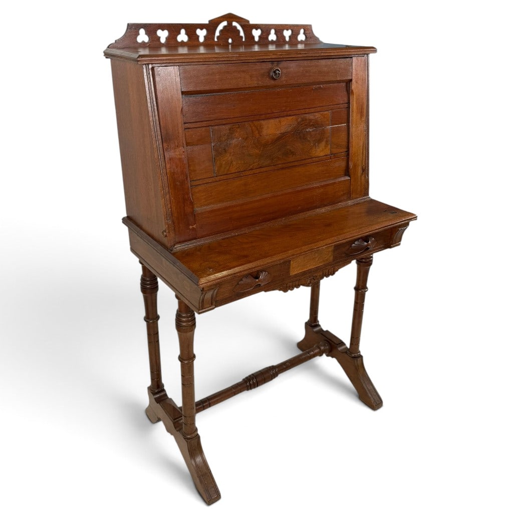 American Eastlake Walnut and Burl Drop-Front Writing Desk: Origin: American Date: Circa 1880-1890 Period/Style: Eastlake, Aesthetic Movement, Modern Gothic Materials: Walnut, burl walnut veneer, mixed secondary woods, brass hardware, and green writing