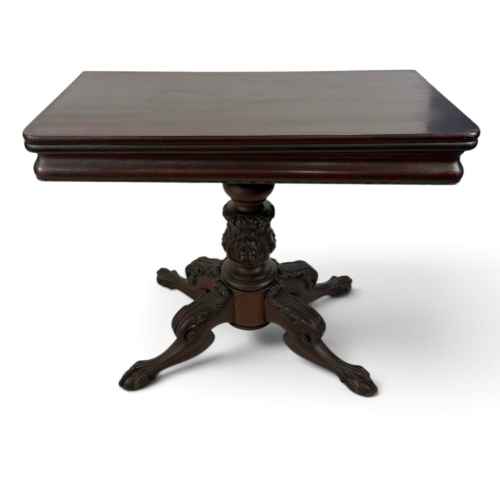 American Classical Carved Mahogany Card Table, Probably New York: Origin: American, probably New York Date: Circa 1825-1835 Period/Style: American Classical Materials: Mahogany, mahogany veneer, mixed secondary woods, and metal hardware Description: A