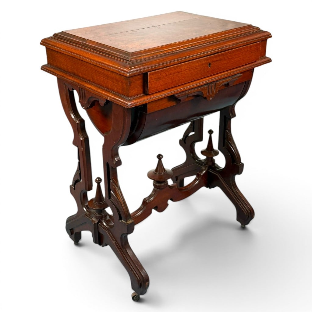 Renaissance Revival Walnut Sewing Table: Origin: American Date: Circa 1870-1885 Period/Style: Victorian, Renaissance Revival Materials: Walnut, burl-walnut veneer, mixed secondary woods, and metal casters Form: Sewing or work table Descri