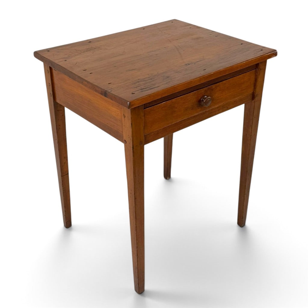 American Country Pine Peg-Joined Work Table: Origin: American Date: Circa 1840-1870 Period/Style: Country, Vernacular Materials: Pine, wood pull, and metal fasteners Form: One-drawer work table Description: An American country work table