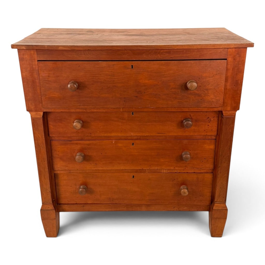 American Country Empire Cherry Chest of Drawers: Origin: American Date: Circa 1840-1860 Period/Style: Country Empire Materials: Cherry, mixed secondary woods, wood pulls, and metal locks Form: Chest of drawers Description: An American Country