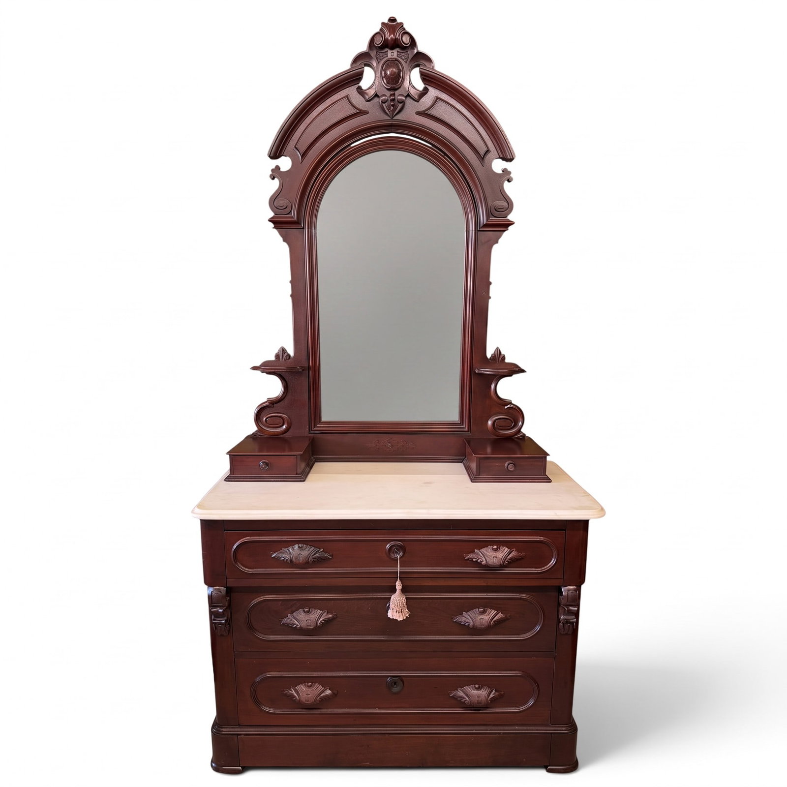 Mahogany Marble Top Dresser with Mirror: Origin: American Date: Circa 1870-1885 Period/Style: Victorian, Renaissance Revival Materials: Mahogany, mahogany veneer, mixed secondary woods, white marble, mirrored glass, brass hardware, and metal