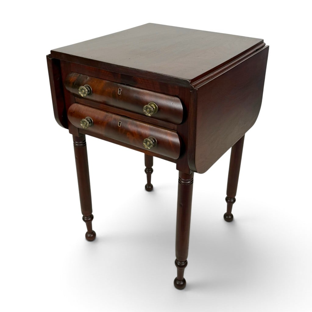 Southern Sheraton Mahogany Drop-Leaf Work Table, Possibly Tennessee: Origin: American South, possibly Tennessee Date: Circa 1830-1840 Period/Style: Sheraton Materials: Mahogany, figured mahogany veneer, mixed secondary woods, and brass hardware Form: Two-drawer