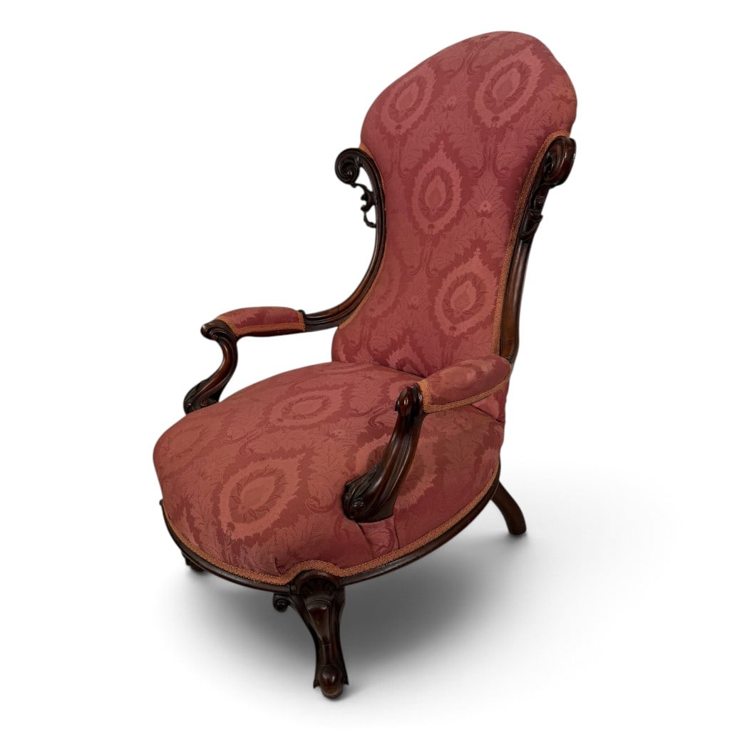 Rococo Revival Walnut Parlor Armchair: Origin: American Date: Circa 1860-1880 Period/Style: Victorian, Rococo Revival Materials: Carved walnut, mixed secondary woods, later damask upholstery, and metal fasteners Form: Upholstered parlor