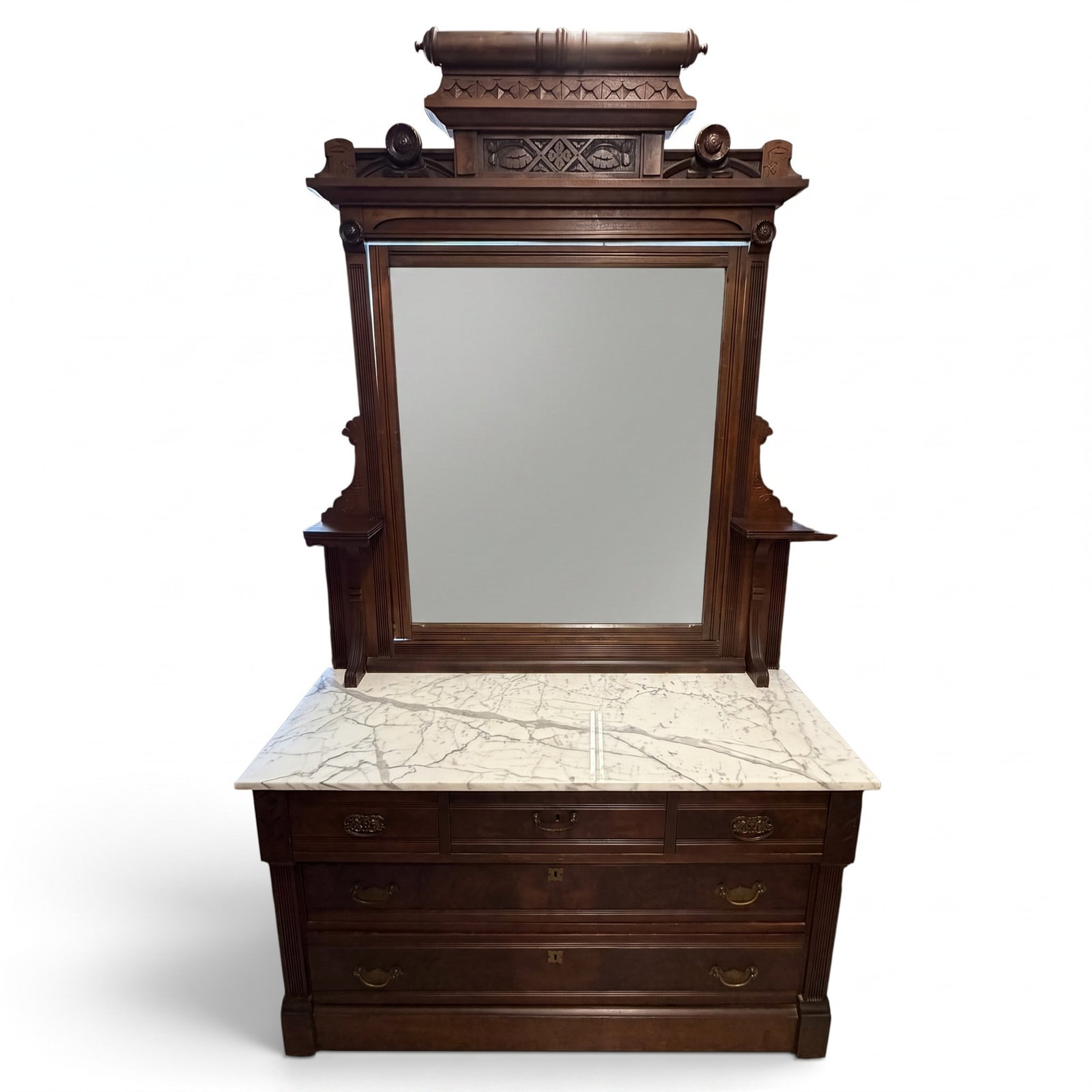 Eastlake Walnut Marble Top Dresser: Origin: American Date: Circa 1880-1890 Period/Style: Victorian, Eastlake Materials: Walnut, burl walnut veneer, mixed secondary woods, white marble, mirrored glass, brass hardware, and metal