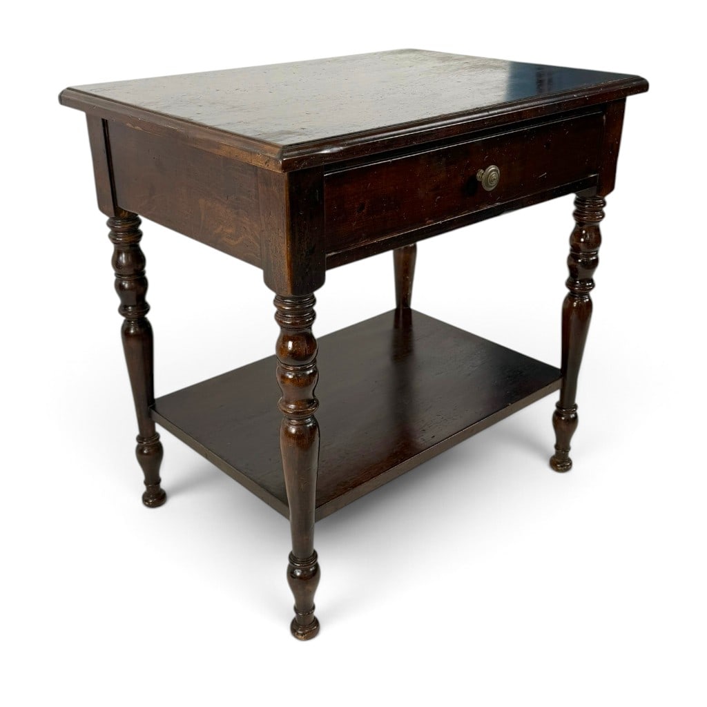 American Late Sheraton Walnut One-Drawer Stand: Origin: American Date: Circa 1840-1860 Period/Style: Late Sheraton Materials: Walnut, mixed secondary woods, brass hardware, and later paper lining Form: One-drawer stand Description: An American