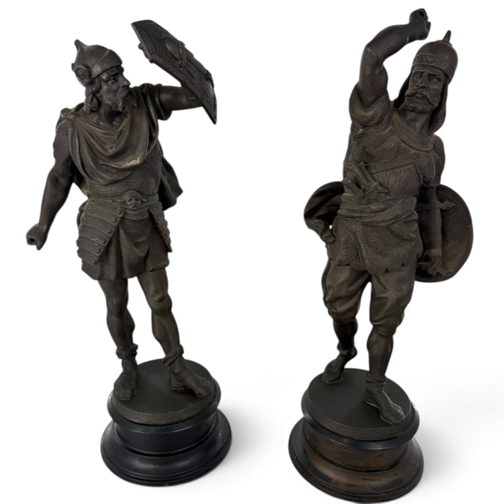 Pair French Spelter Warrior Figures: Origin: France Date: Circa 1880-1900 Period/Style: Victorian, Classical and Renaissance Revival Materials: Patinated spelter or zinc alloy and ebonized wood Form: Pair of standing warrior figures