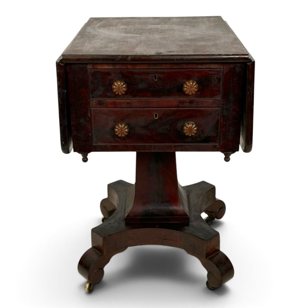 American Classical Mahogany Drop-Leaf Sewing Table, Circa 1830-1845: Origin: American Date: Circa 1830-1845 Period/Style: American Classical Materials: Mahogany, mahogany veneer, mixed secondary woods, brass hardware, later green felt, and metal casters Description: