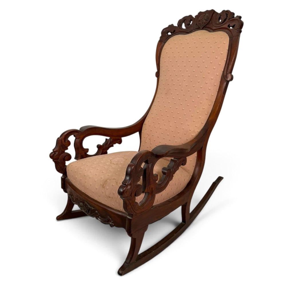 American Rococo Revival Carved Walnut Lincoln Rocking Chair, Circa 1870-1890: Origin: American Date: Circa 1870-1890 Period/Style: Victorian, Rococo Revival Materials: Carved walnut, mixed secondary woods, later damask upholstery, and metal fasteners Form: Lincoln-style