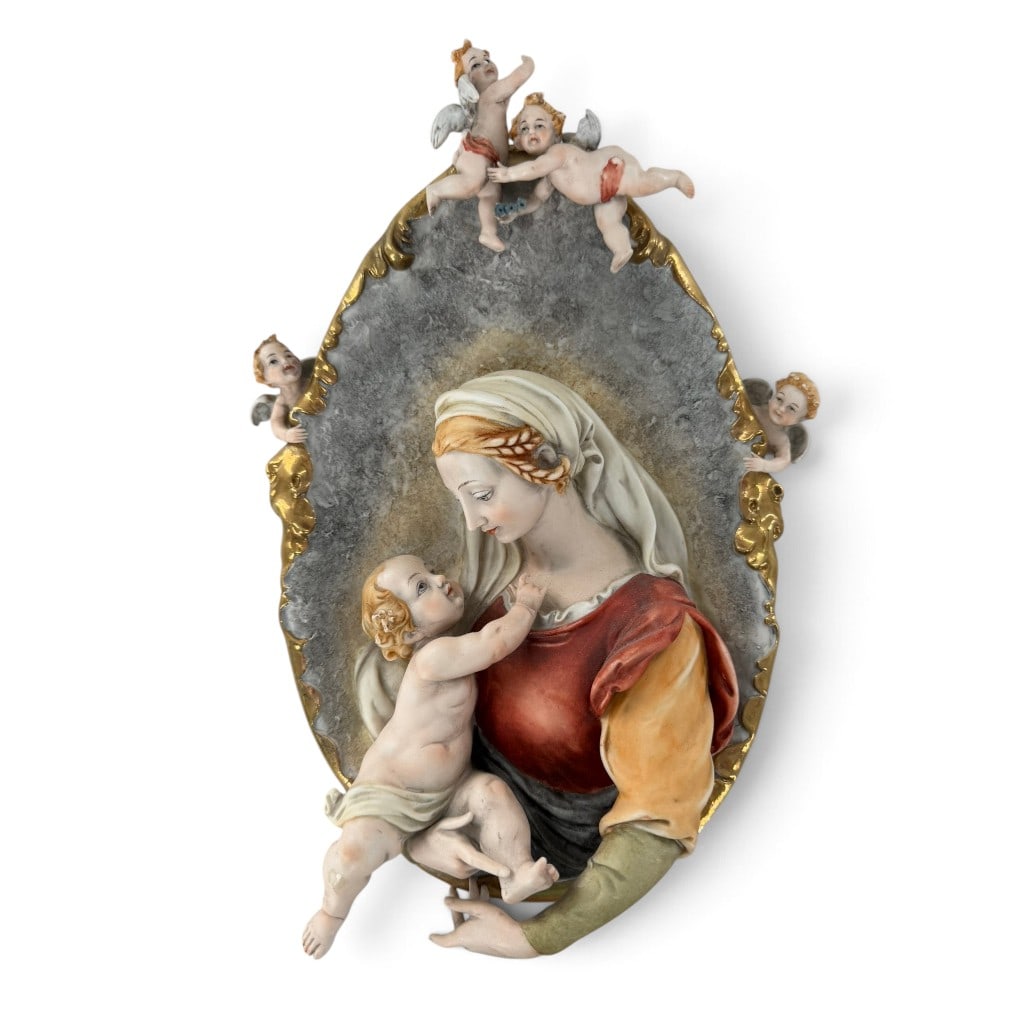 Capodimonte-Style Madonna Wall Plaque: Origin: Probably Italian Date: Second half of the 20th century Period/Style: Capodimonte style, Baroque Revival Maker: Unidentified Materials: Polychrome and gilt porcelain Form: Oval wall plaque