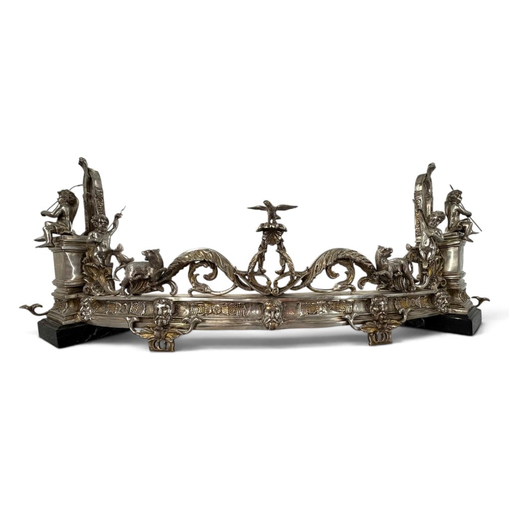 Continental Silvered-Bronze Figural Fender: Origin: Continental Europe, probably French Date: Circa 1880-1900 Period/Style: Renaissance Revival and Beaux-Arts Maker: Unidentified Materials: Silvered bronze, metal supports, and black stone
