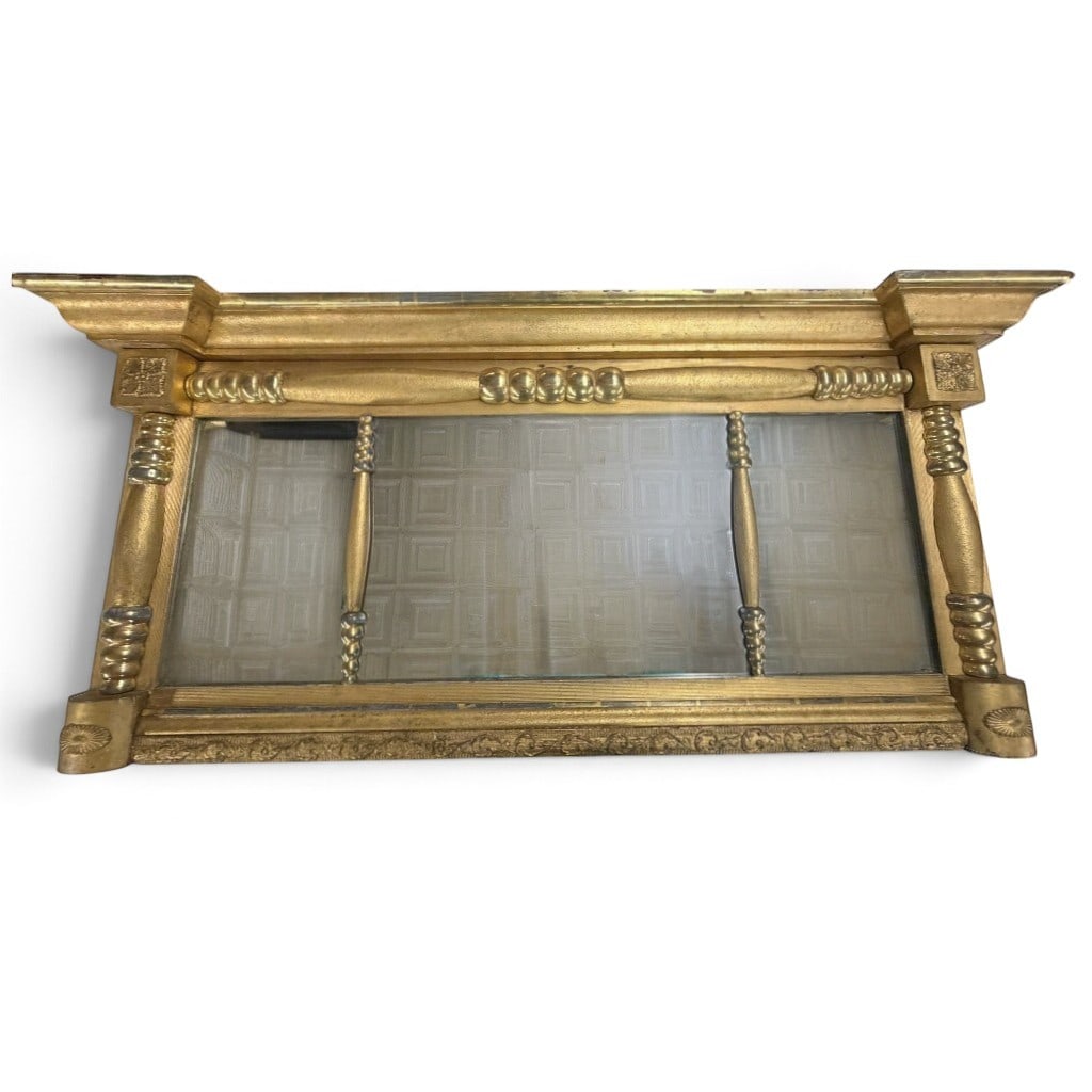 American Classical Gilt Overmantel Mirror: Origin: American Date: Circa 1825-1840 Period/Style: American Classical Materials: Gilt and silvered wood, composition ornament, mirror glass, and softwood backboards Form: Triple-plate overmantel