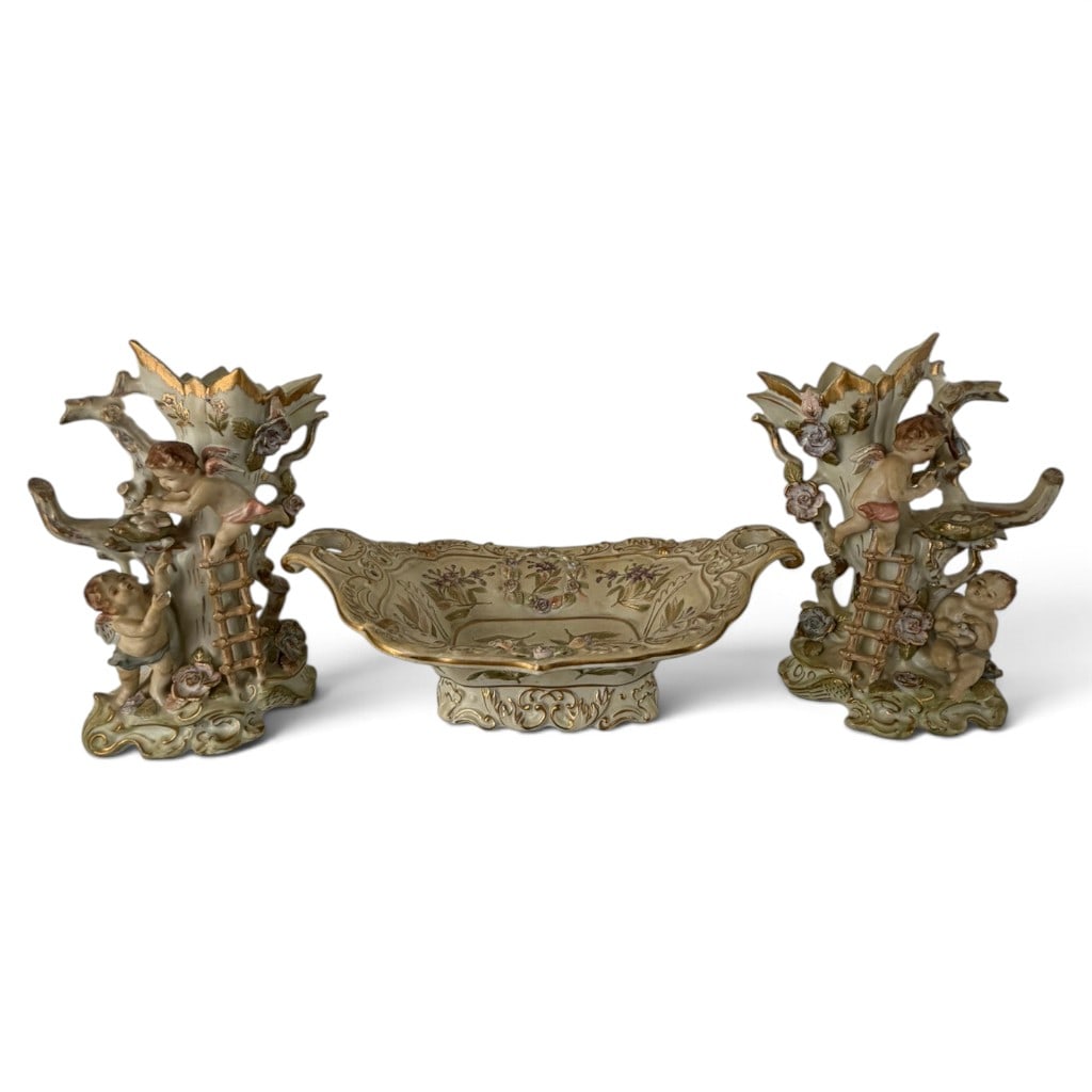 Ardalt Lenwile Cherub Porcelain Garniture: Origin: Japan Date: Circa 1950-1960 Period/Style: Rococo Revival, Capodimonte style Maker/Distributor: Lenwile China for Ardalt Materials: Hand-painted porcelain with applied decoration and gilding
