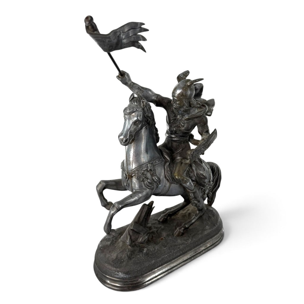 Spelter Medieval Knight on Horseback: Origin: Continental Europe Date: Late 19th to early 20th century Period/Style: Romantic Historicism Maker: Unidentified Materials: Cast spelter, steel rod, and metal chain Form: Equestrian figure