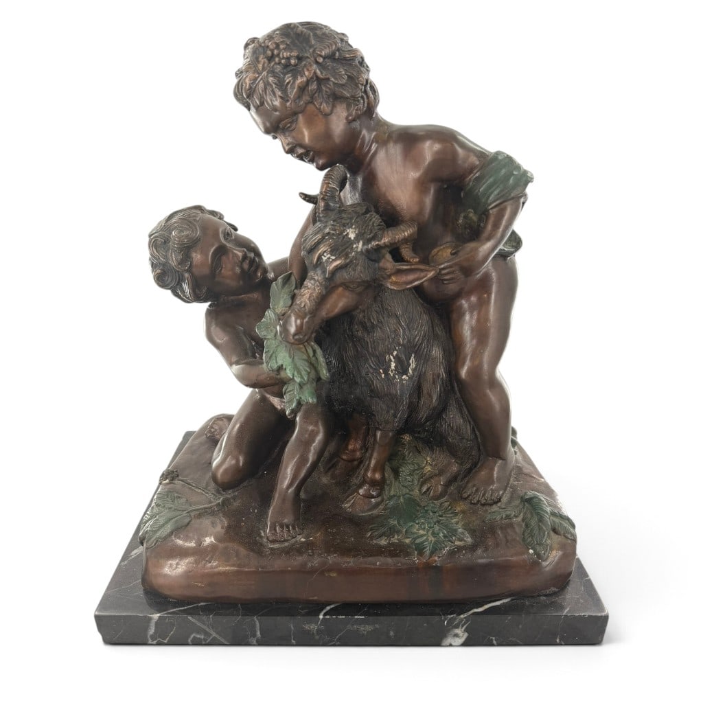 After Auguste Moreau Putti and Goat Bronze: Origin: Continental Europe Date: 20th century, after a circa-1880 model Period/Style: Belle Epoque and Neoclassical Revival Maker: After Auguste Moreau Materials: Patinated bronze and black marble