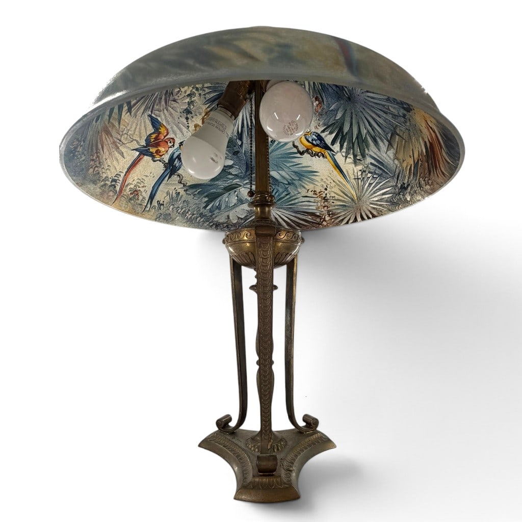 Pairpoint Jungle Bird Reverse-Painted Lamp: Origin: United States Date: Circa 1920 Period/Style: American Art Glass and Art Nouveau Maker: Pairpoint Corporation Materials: Reverse-painted acid-etched glass, silver-plated metal, and electrical
