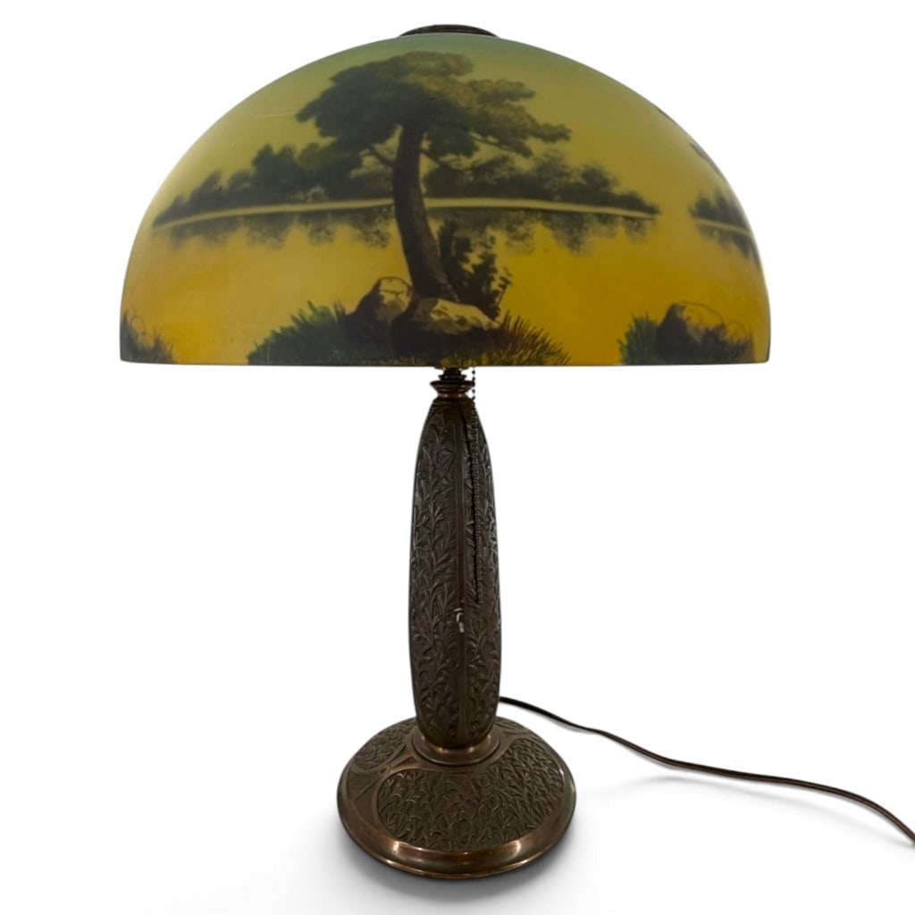 Reverse-Painted Scenic Glass Table Lamp: Origin: American Date: Circa 1920s Period/Style: Arts and Crafts / Art Deco transitional Maker: Unidentified Materials: Reverse-painted glass, bronze-finished cast metal, brass socket hardware, and