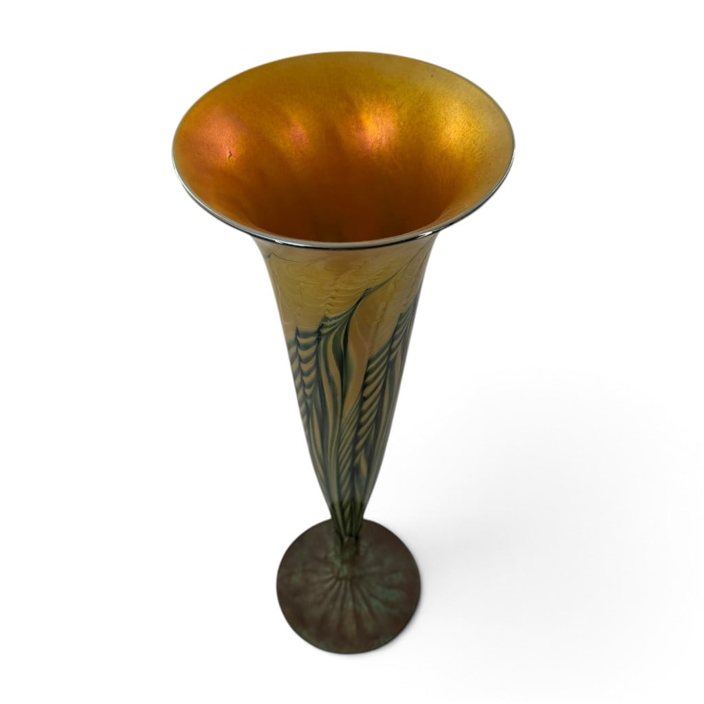 Attributed Tiffany Studios Trumpet Vase: Origin: American Date: Early 20th century Period/Style: Art Nouveau Maker: Attributed to Tiffany Studios Materials: Iridescent art glass and patinated bronze Form: Trumpet vase Description: An