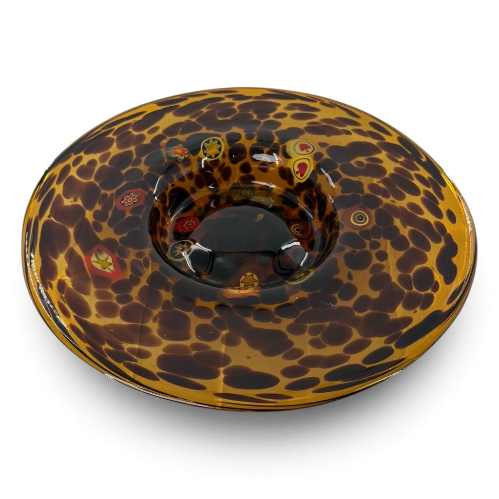 Large Tortoiseshell Murrine Glass Bowl: Origin: Probably Murano, Italy Date: Mid- to late 20th century Period/Style: Mid-Century Modern Maker: Unidentified Materials: Blown amber art glass with murrine and iridescent inclusions Form: