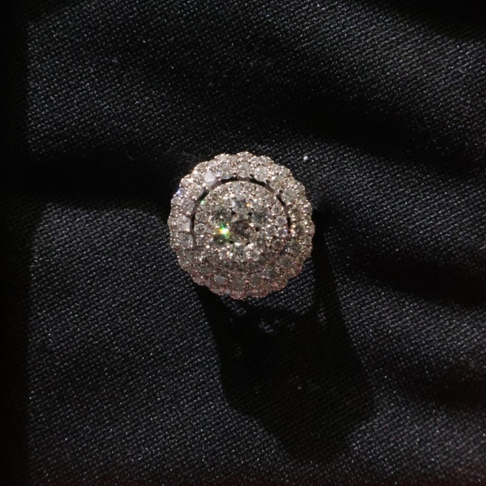 18K White Gold 1.48 CTW Diamond Ring: Date: Late 20th to early 21st century Materials: 18K white gold and diamonds Form: Ring Description: An 18K white gold diamond ring with a raised multi-stone crown and diamond-set shoulders. The consi