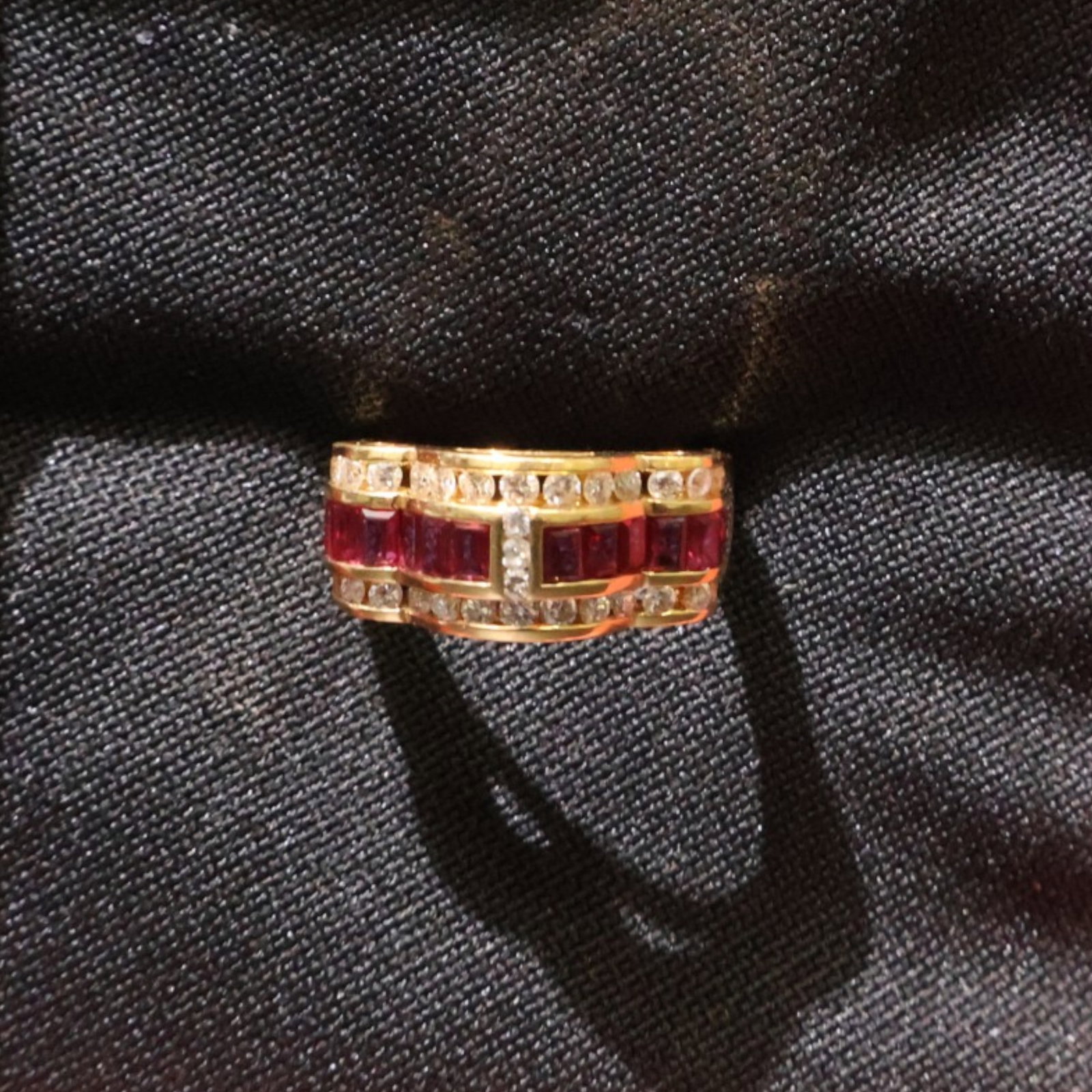 18K Ruby and Diamond Ring: Date: Late 20th to early 21st century Materials: 18K yellow gold, ruby, and diamonds Form: Ring Description: An 18K yellow gold ring centered by a ruby and framed by diamond accents. The consignor