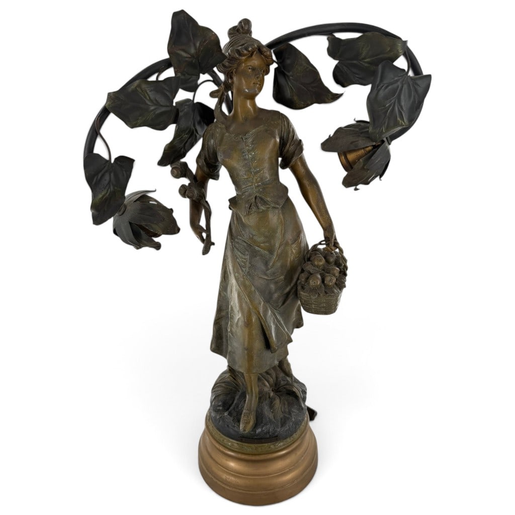 Emile Bruchon "Retour des Champs" Lamp: Origin: France Date: Circa 1900 Period/Style: Art Nouveau Maker: Emile Bruchon Materials: Patinated spelter, painted metal, and electrical fittings Form: Figural table lamp Description: French Belle