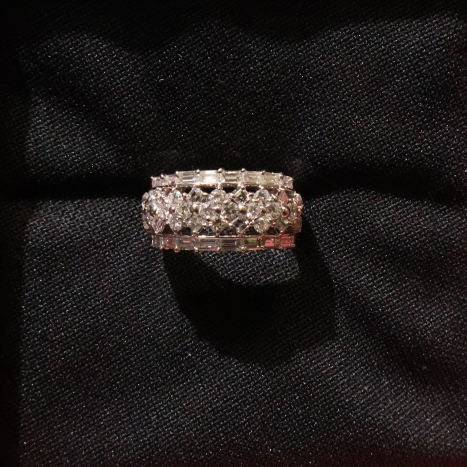 18K White Gold 2.03 CTW Diamond Ring: Date: Late 20th to early 21st century Materials: 18K white gold and diamonds Form: Ring Description: An 18K white gold ring set with a prominent diamond cluster and diamond accents along the