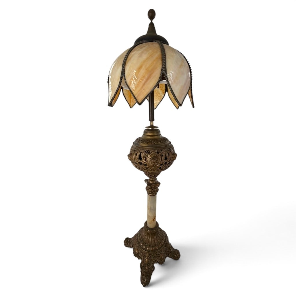 Art Nouveau-Style Slag Glass Lamp: Origin: Probably American Date: 20th century Period/Style: Art Nouveau and Rococo Revival style Maker: Unmarked Materials: Slag glass, cast metal, and onyx or marble Form: Table or parlor lamp
